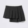 Asymmetric Pleated Wrap Mini Skirt – Black Asymmetric Pleated Wrap Mini Skirt – Black