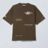 Boxy Printed Graphic T-Shirt – Dark Brown – Sports Logos Boxy Printed Graphic T-Shirt – Dark Brown – Sports Logos