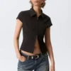 Fitted Short-Sleeved Zip Top – Striped Black Fitted Short-Sleeved Zip Top – Striped Black