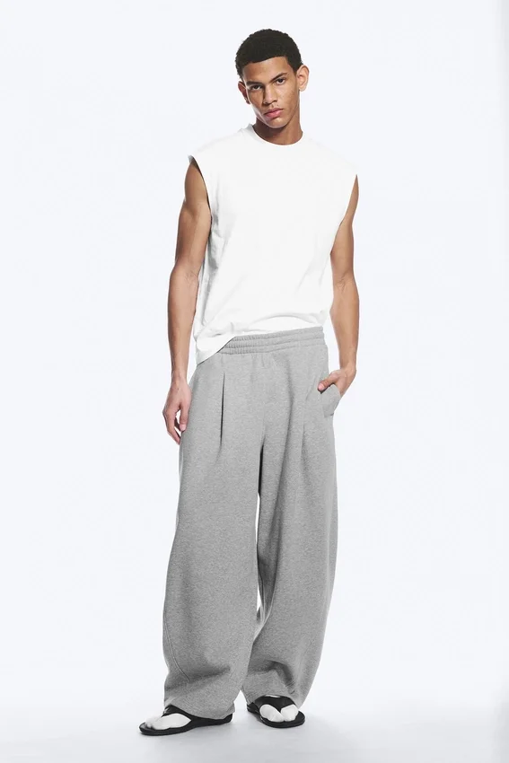 Loose Pleated Sweatpants – Grey Melange Loose Pleated Sweatpants – Grey Melange