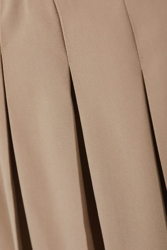 Low Pleated Mini Skirt – Dusty Beige Low Pleated Mini Skirt – Dusty Beige