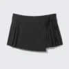 Low Rise Pleated Mini Wrap Skirt – Black Low Rise Pleated Mini Wrap Skirt – Black