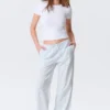 Low-Rise Relaxed Pull-On Trousers – White – Blue Stripes Low-Rise Relaxed Pull-On Trousers – White – Blue Stripes
