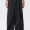 Mid Rise Loose Baggy Leg Nylon Trousers – Black Mid Rise Loose Baggy Leg Nylon Trousers – Black