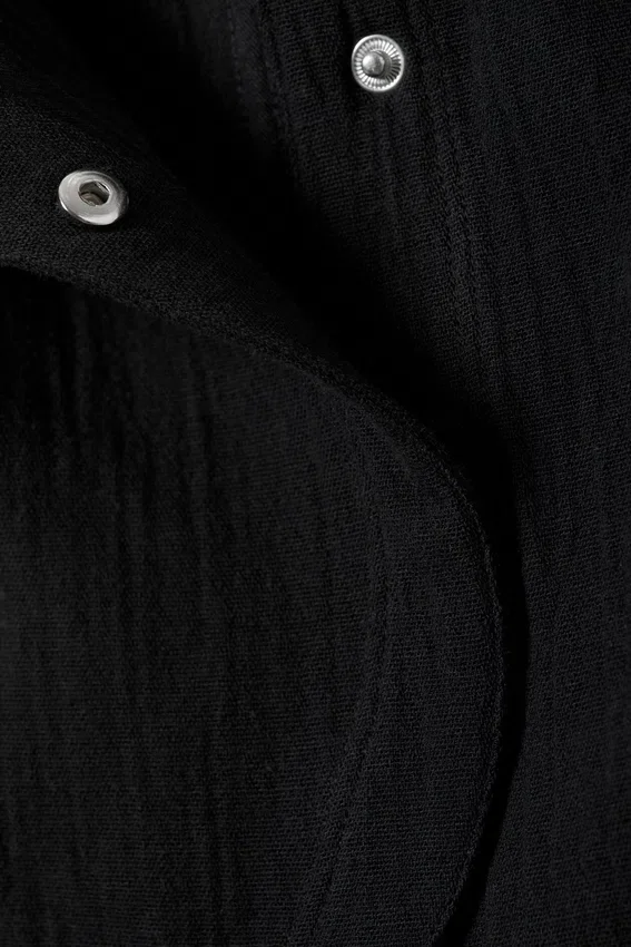 Sleeveless Asymmetric Peplum Top – Black Sleeveless Asymmetric Peplum Top – Black