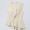 Sleeveless Asymmetric Peplum Top – Ecru Sleeveless Asymmetric Peplum Top – Ecru