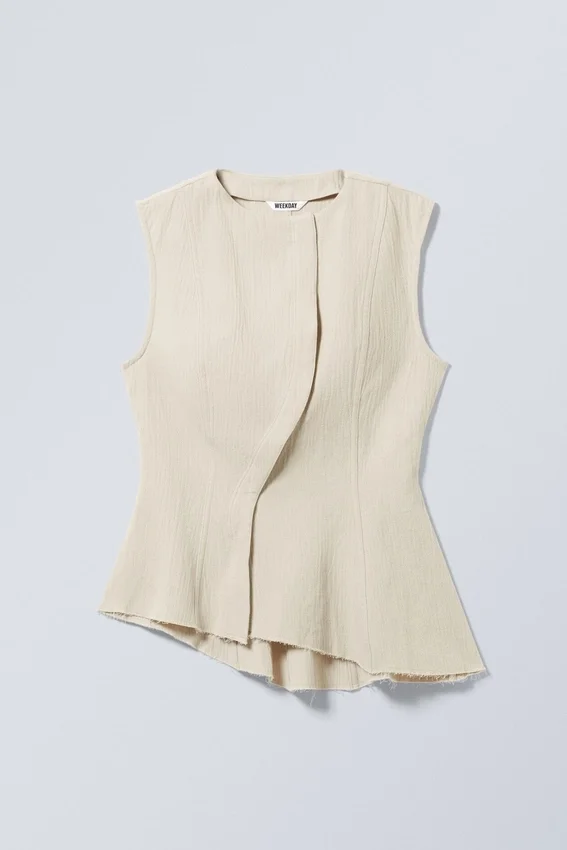 Sleeveless Asymmetric Peplum Top – Ecru Sleeveless Asymmetric Peplum Top – Ecru