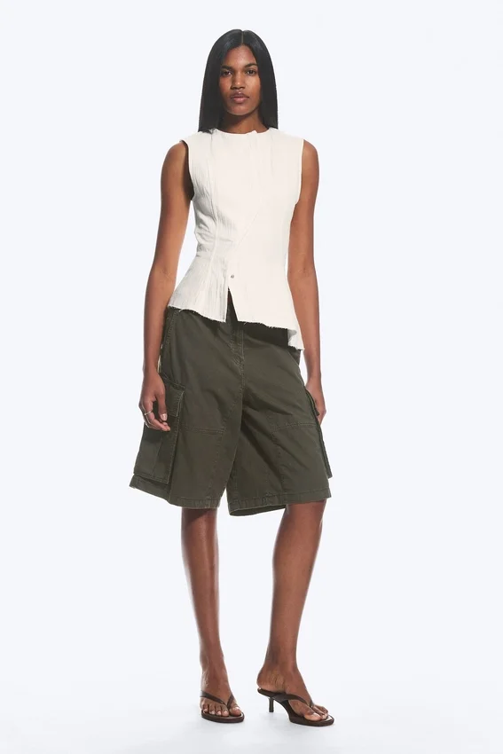 Sleeveless Asymmetric Peplum Top – White Sleeveless Asymmetric Peplum Top – White