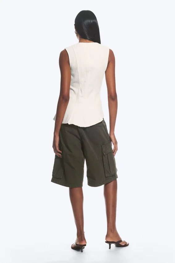 Sleeveless Asymmetric Peplum Top – White Sleeveless Asymmetric Peplum Top – White