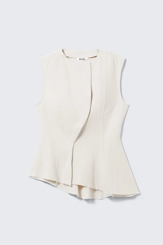 Sleeveless Asymmetric Peplum Top – White Sleeveless Asymmetric Peplum Top – White