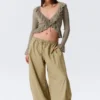 Yulia B Frilled Knitted V-Neck Cardigan – Dusty Khaki Green Yulia B Frilled Knitted V-Neck Cardigan – Dusty Khaki Green